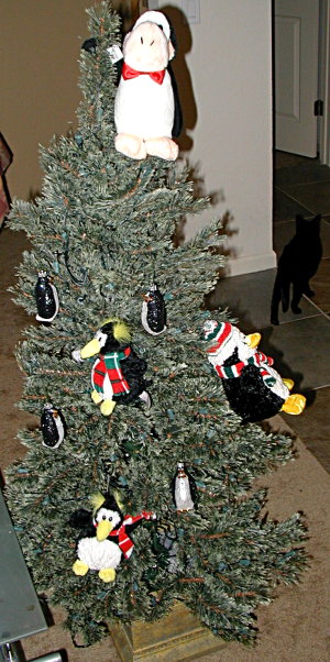 Christmas tree with penguins all over it