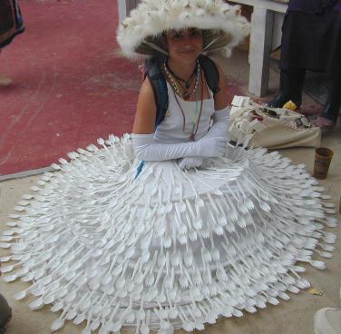 woman wearing a gown with sporks attached to it