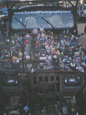 better than your average Jeep art Jeep with a bunch of plastic toys glued to it
