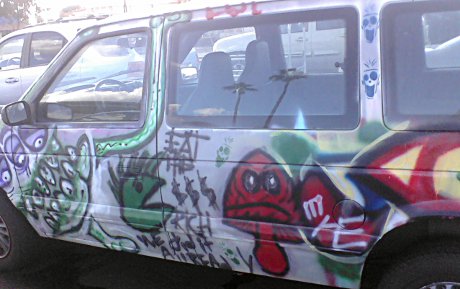 not the furniture store, a VAN with ART on it! van with a bunch of amateur art on it