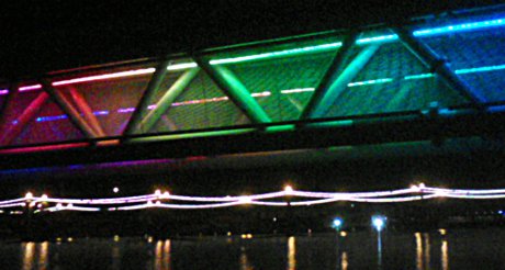 a low-traffic bridge bridge in Tempe covered in colored lights
