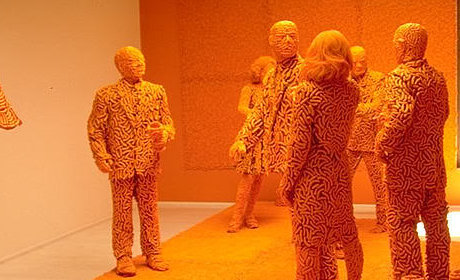 more cheese than most people can handle people sculpted out of cheese doodles