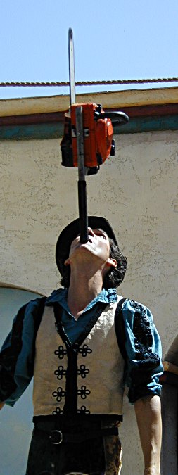 yes, this is BADASS Dextre Tripp balancing a chainsaw on his chin