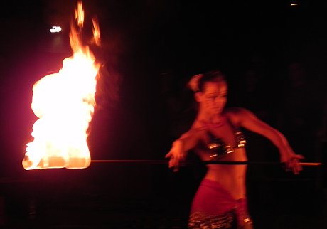 don't try this at home; try it at YOUR FRIEND'S HOUSE! woman dancing with a flaming baton