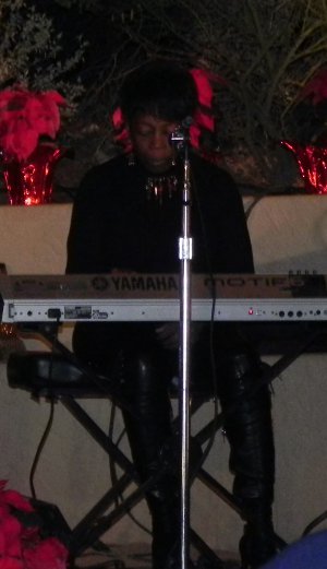 R and B in the house, eh? Huney Brown, group performing at the Luminarias