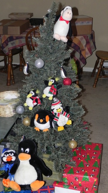 MORE PENGUINS!!1! Christmas tree with a bunch of penguins in it