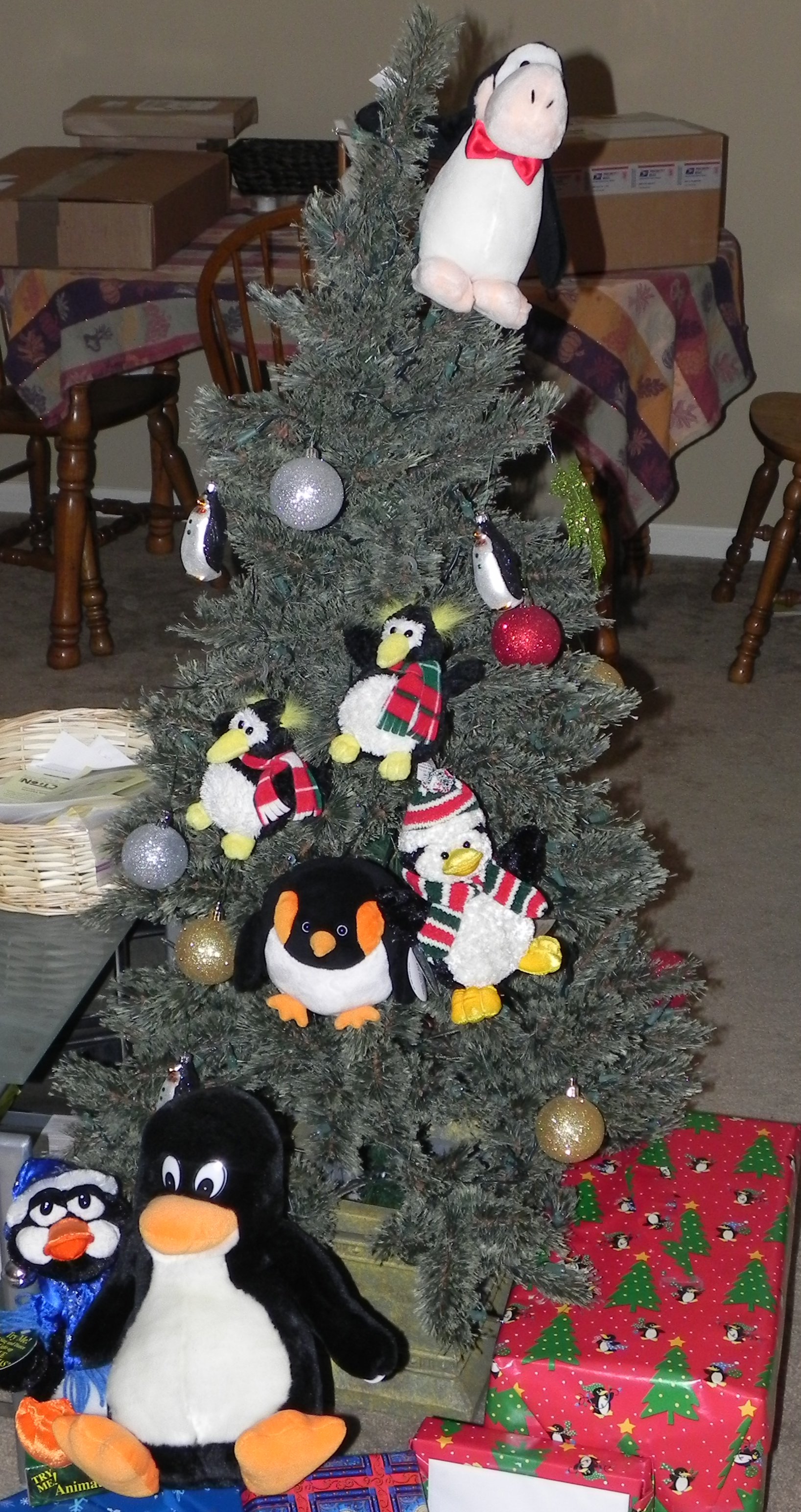 MORE PENGUINS!!1! Christmas tree with a bunch of penguins in it