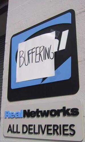 no streaming video for YOU! Real Networks sign, with 'Buffering' taped to it