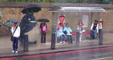 no, the Cat Bus doesn't stop here someone dressed up as Totoro at a bus stop in Japan
