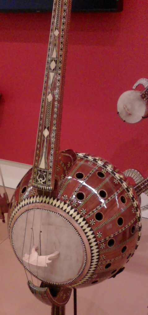 portable cello Uigher stringed instrument, sort of like a cello