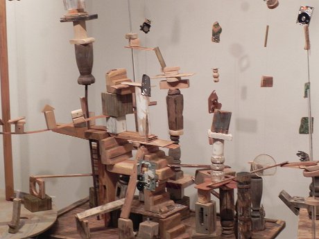 sculpture made out of wooden blocks, where visitors are allowed to move the blocks