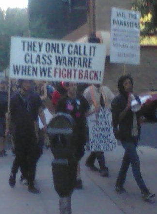 Occupy Phoenix protesters carrying signs and marching
