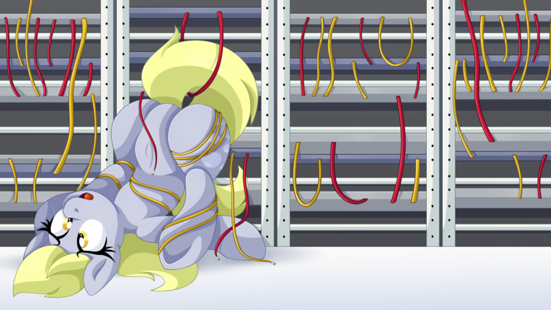 A pony upside down in a server rack, looking very spaced out. (Fark's servers were hit hard by lots of people commenting on the Charlie Kirk assassination.)