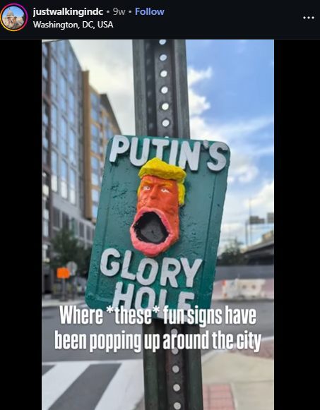 Signs appeared in Washington DC labeled 'Putin's glory hole' with a caricature of Trump with his mouth open.