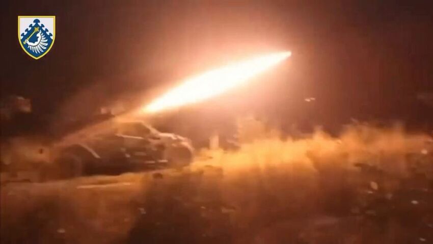 The Tempest anti-air platform, firing a missile at night.